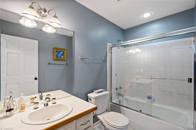 6404 Muirfield Dr, Greensboro, NC 27410 - bathroom featuring toilet, vanity, and combined bath / shower with glass door