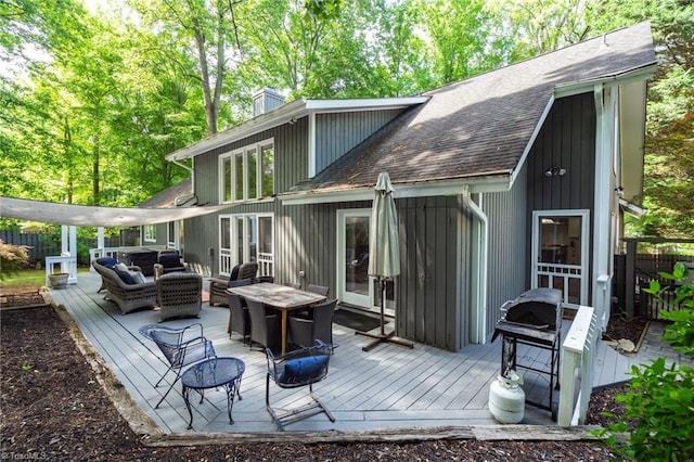 6404 Muirfield Dr, Greensboro, NC 27410 - rear view of property with outdoor lounge area, a wooden deck, roof with shingles, and a chimney