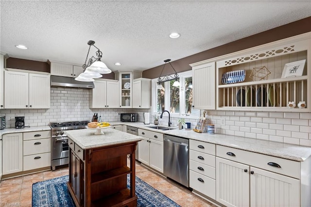 6404 Muirfield Dr, Greensboro, NC 27410 - kitchen with open shelves, stainless steel appliances, under cabinet range hood, tasteful backsplash, and a sink