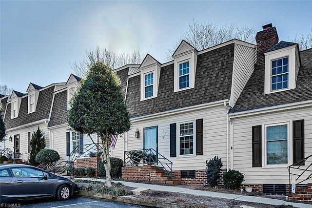 view of new england style home