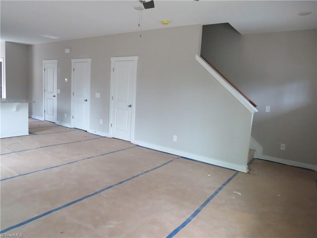 unfurnished living room featuring ceiling fan