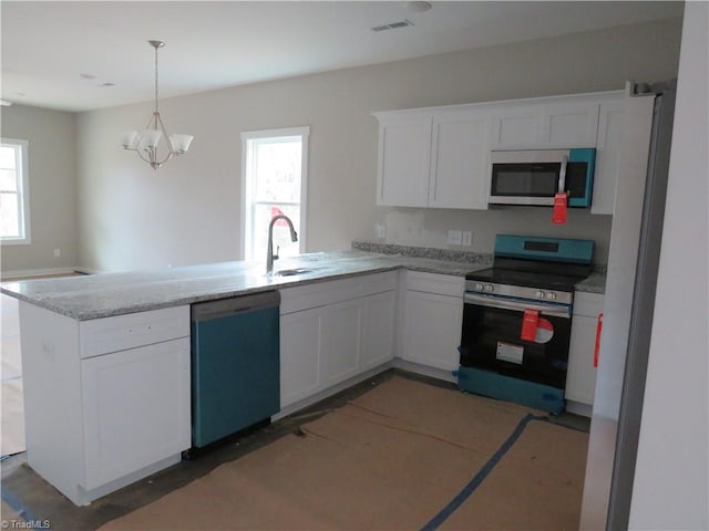 kitchen featuring plenty of natural light, white cabinetry, and appliances with stainless steel finishes