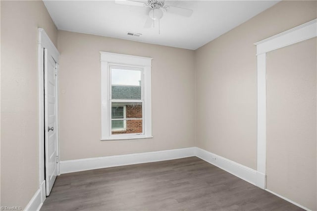 unfurnished bedroom featuring visible vents, baseboards, wood finished floors, and a ceiling fan