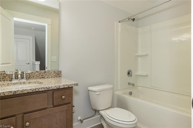 bathroom featuring shower / washtub combination, vanity, and toilet