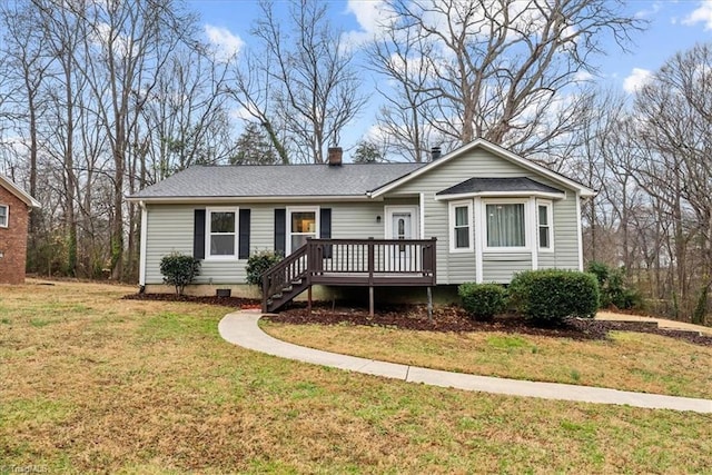 view of front facade featuring a deck and a front yard