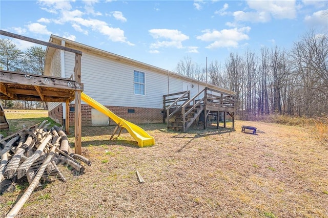 rear view of house with a playground