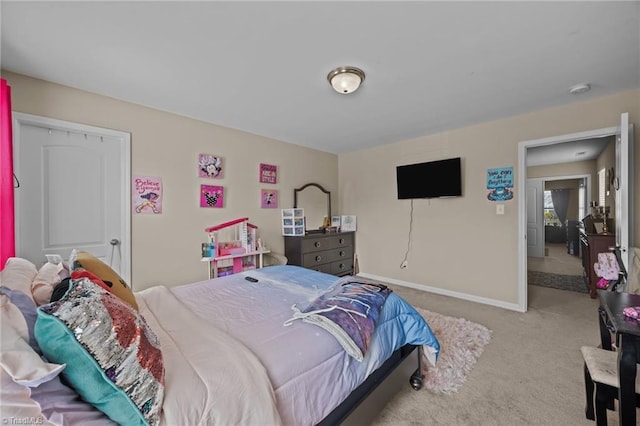 bedroom featuring carpet and baseboards