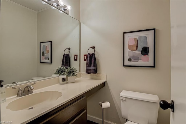 1935 Eastchester Dr Unit B, High Point, NC 27265 - bathroom featuring toilet, vanity, and ornamental molding