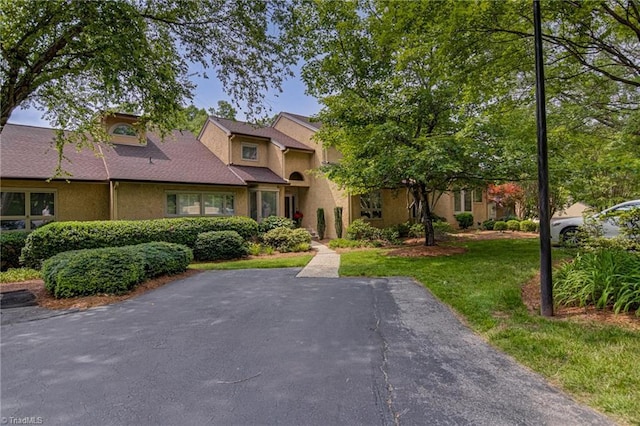 1935 Eastchester Dr Unit B, High Point, NC 27265 - view of front of house featuring stucco siding and a front lawn