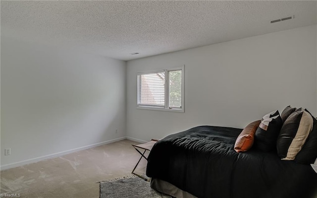 1935 Eastchester Dr Unit B, High Point, NC 27265 - bedroom with carpet floors, baseboards, and a textured ceiling