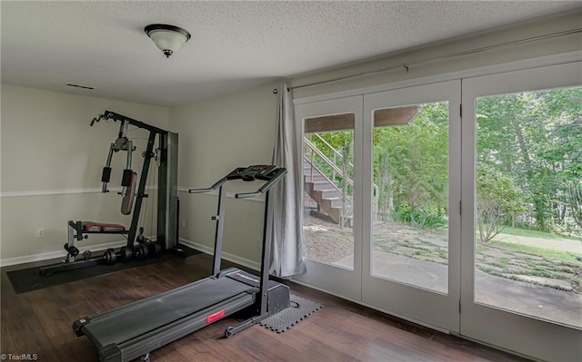 1935 Eastchester Dr Unit B, High Point, NC 27265 - workout room with wood finished floors, a textured ceiling, and baseboards