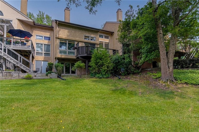 1935 Eastchester Dr Unit B, High Point, NC 27265 - rear view of house with a yard, stairway, and stucco siding