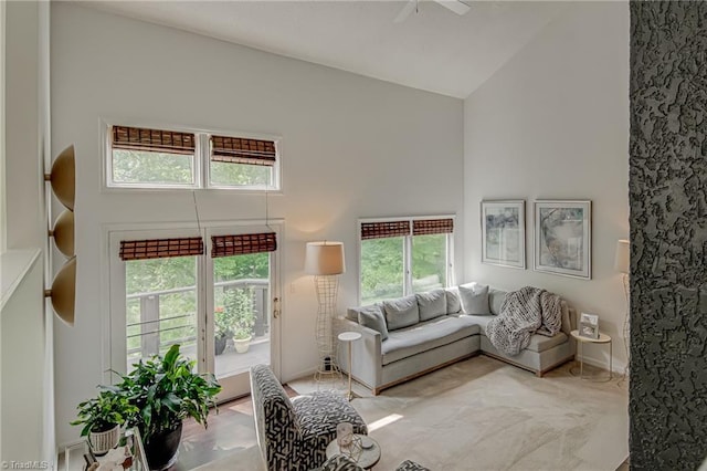1935 Eastchester Dr Unit B, High Point, NC 27265 - living room featuring high vaulted ceiling, plenty of natural light, ceiling fan, and baseboards