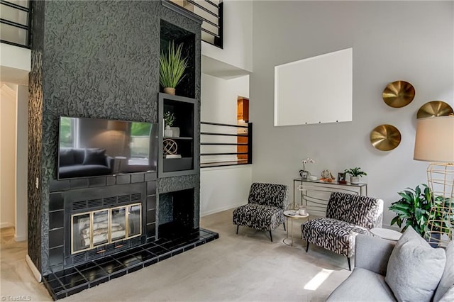 1935 Eastchester Dr Unit B, High Point, NC 27265 - living area with a tile fireplace, carpet floors, and baseboards