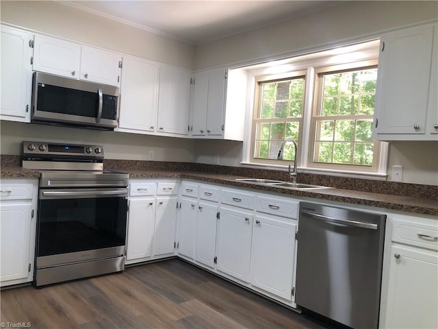 3960 Wards Gap, Cana, VA 24317 - kitchen with appliances with stainless steel finishes, a sink, white cabinets, dark countertops, and dark wood finished floors