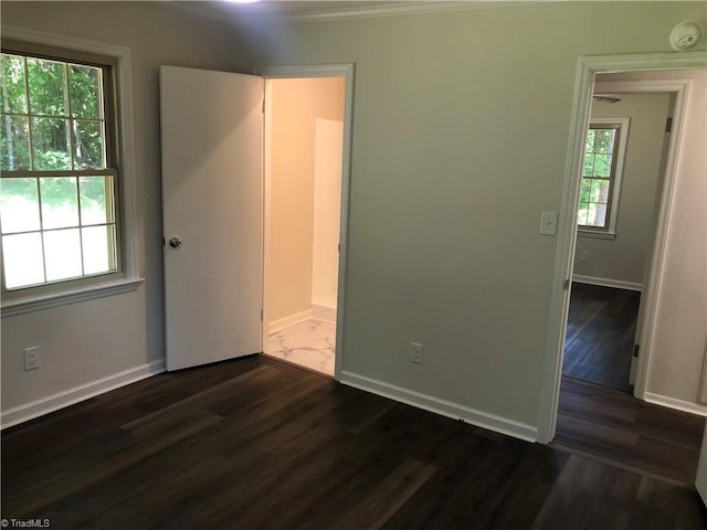 3960 Wards Gap, Cana, VA 24317 - unfurnished bedroom featuring dark wood finished floors, baseboards, and ornamental molding