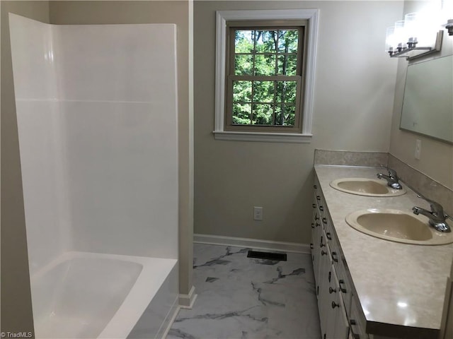 3960 Wards Gap, Cana, VA 24317 - bathroom featuring marble finish flooring, double vanity, baseboards, and  shower combination