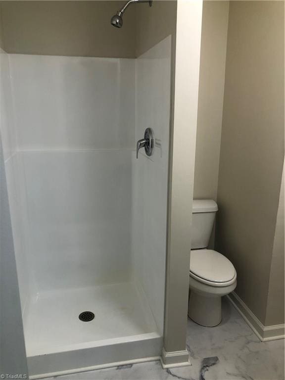 3960 Wards Gap, Cana, VA 24317 - full bathroom featuring a shower stall, toilet, marble finish flooring, and baseboards