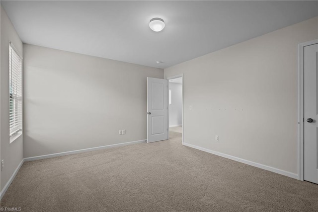 spare room featuring carpet floors