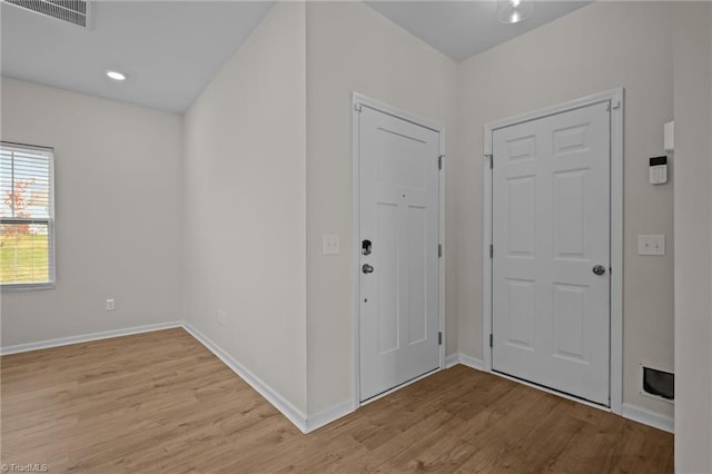 foyer entrance with light hardwood / wood-style flooring