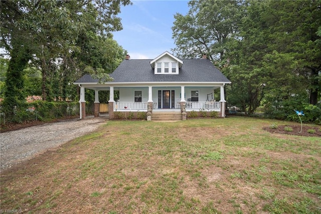 view of front facade with covered porch and a front lawn