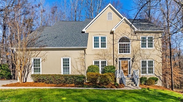 view of front of home with a front lawn