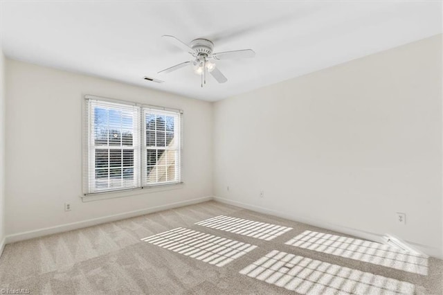 empty room with light carpet and ceiling fan