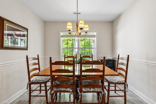 2105 Rosemont Dr, Colfax, NC 27235 - dining space featuring a chandelier, baseboards, and tile patterned flooring