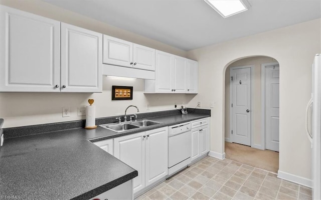 2105 Rosemont Dr, Colfax, NC 27235 - kitchen with a sink, white appliances, dark countertops, and white cabinets