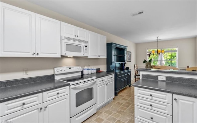 2105 Rosemont Dr, Colfax, NC 27235 - kitchen featuring white appliances, dark countertops, white cabinetry, and pendant lighting