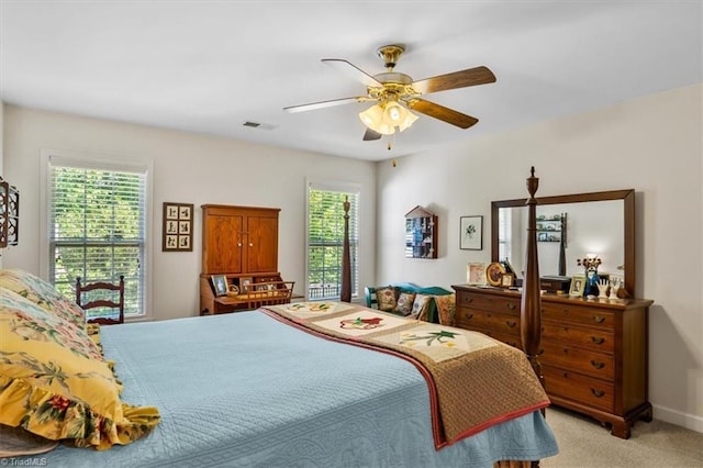 2105 Rosemont Dr, Colfax, NC 27235 - bedroom featuring multiple windows, light colored carpet, ceiling fan, and baseboards