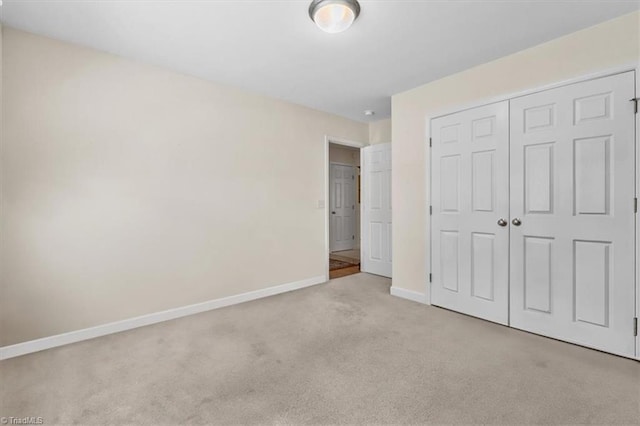 2105 Rosemont Dr, Colfax, NC 27235 - unfurnished bedroom featuring carpet floors, baseboards, and a closet