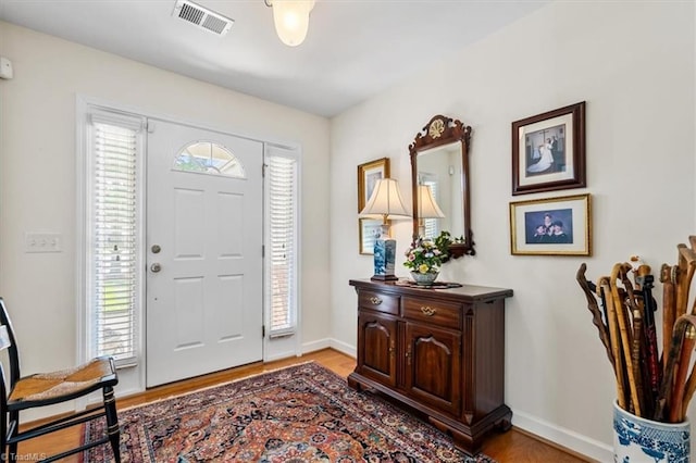 2105 Rosemont Dr, Colfax, NC 27235 - entryway with healthy amount of natural light, wood finished floors, and baseboards