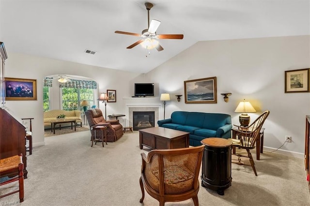 2105 Rosemont Dr, Colfax, NC 27235 - living room with light colored carpet, a ceiling fan, lofted ceiling, baseboards, and a glass covered fireplace