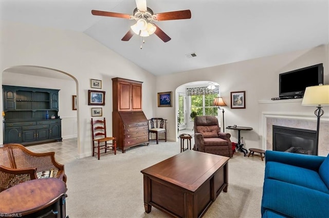 2105 Rosemont Dr, Colfax, NC 27235 - living room with a high end fireplace, lofted ceiling, a ceiling fan, baseboards, and light carpet