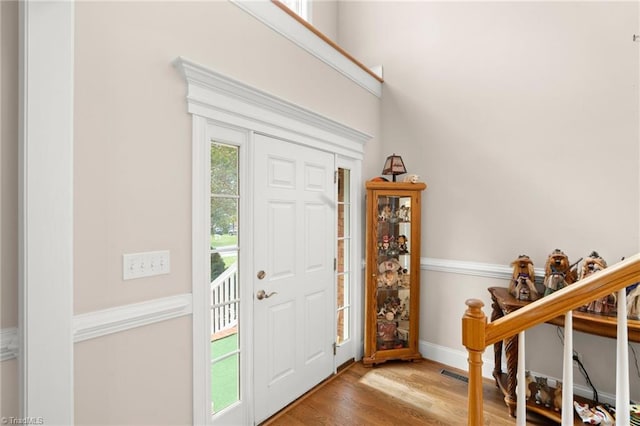 entryway with hardwood / wood-style floors