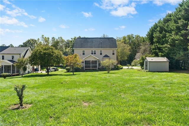 view of yard with a storage unit and a sunroom