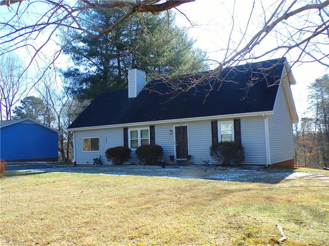 cape cod home featuring a front yard, a chimney, and entry steps