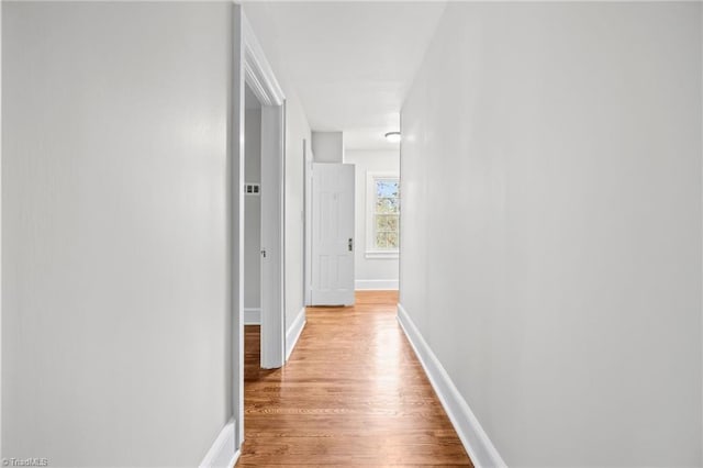 hall with light wood-type flooring