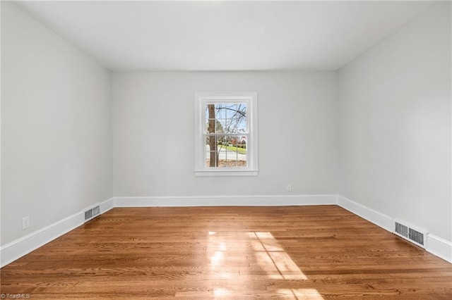 empty room featuring wood-type flooring