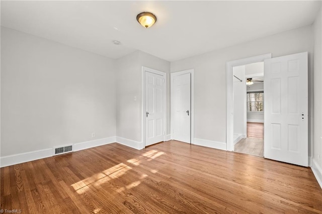 unfurnished bedroom with wood-type flooring