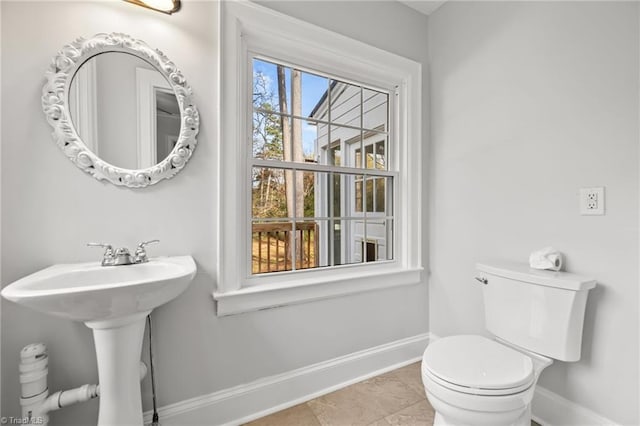 bathroom featuring tile patterned floors and toilet