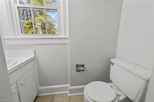 bathroom with tile patterned floors, vanity, and toilet