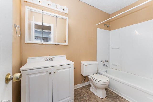 bathroom with baseboards, toilet, vanity, and shower / tub combination