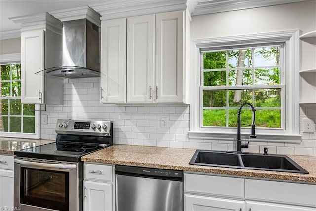 911 Chuppway Ct, Winston-Salem, NC 27106 - kitchen with appliances with stainless steel finishes, wall chimney range hood, ornamental molding, and white cabinets
