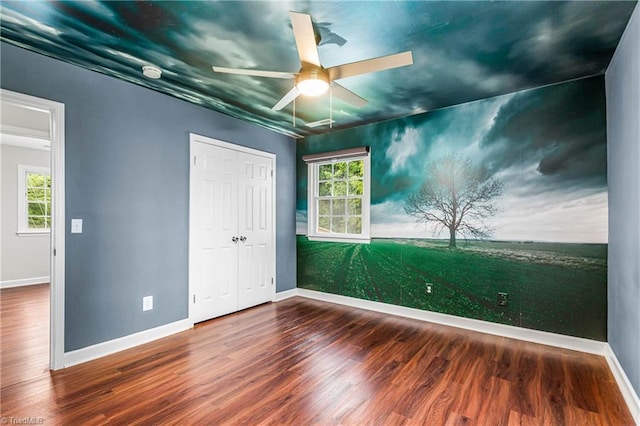 911 Chuppway Ct, Winston-Salem, NC 27106 - unfurnished bedroom with wood finished floors, multiple windows, and a closet