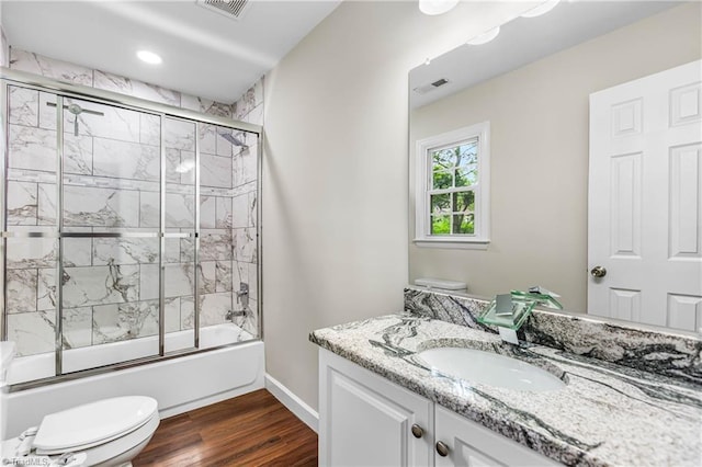 911 Chuppway Ct, Winston-Salem, NC 27106 - full bathroom featuring vanity, wood finished floors, shower / bath combination with glass door, and recessed lighting