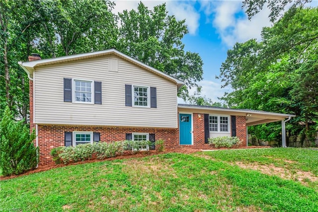 911 Chuppway Ct, Winston-Salem, NC 27106 - tri-level home with a front lawn, brick siding, and a chimney