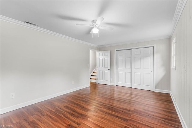 911 Chuppway Ct, Winston-Salem, NC 27106 - unfurnished bedroom with ornamental molding, wood finished floors, a closet, and a ceiling fan