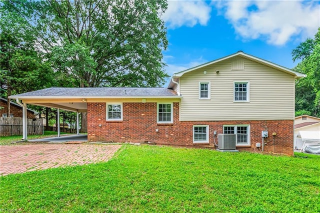 911 Chuppway Ct, Winston-Salem, NC 27106 - rear view of house featuring brick siding, a carport, and driveway